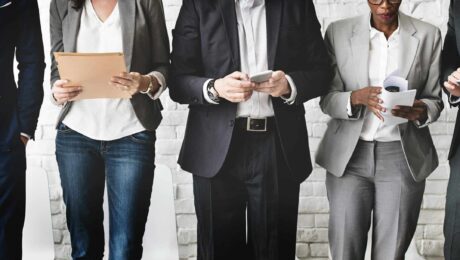 Equity for Startup Advisors – Striking the Right Balance Between Value and Compensation a group of people standing in front of a white brick wall