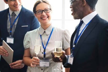 a group of people holding wine glasses