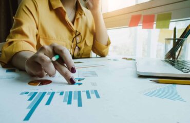 a person pointing at a graph