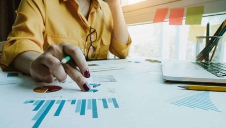 a person pointing at a graph