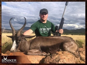 Plains Game Hunting in Africa - Hunt Plains Game with Nick Bowker 57 Client with a black springbok trophy shot while hunting in Africa.