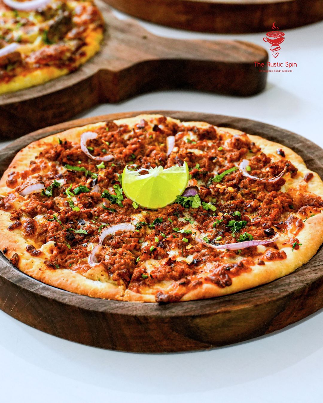 Pizza topped with mutton kheema and lime