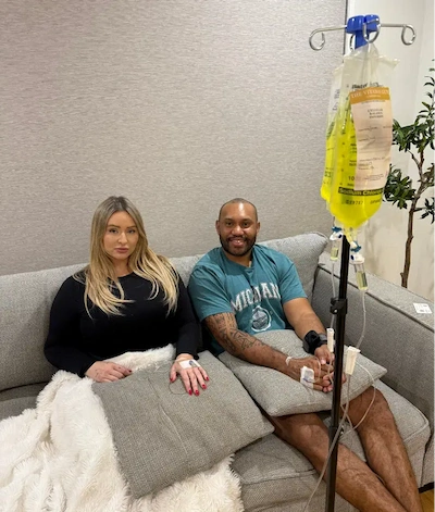 Couple receiving mobile IV vitamin therapy for hangover recovery &mdash; Gold Coast