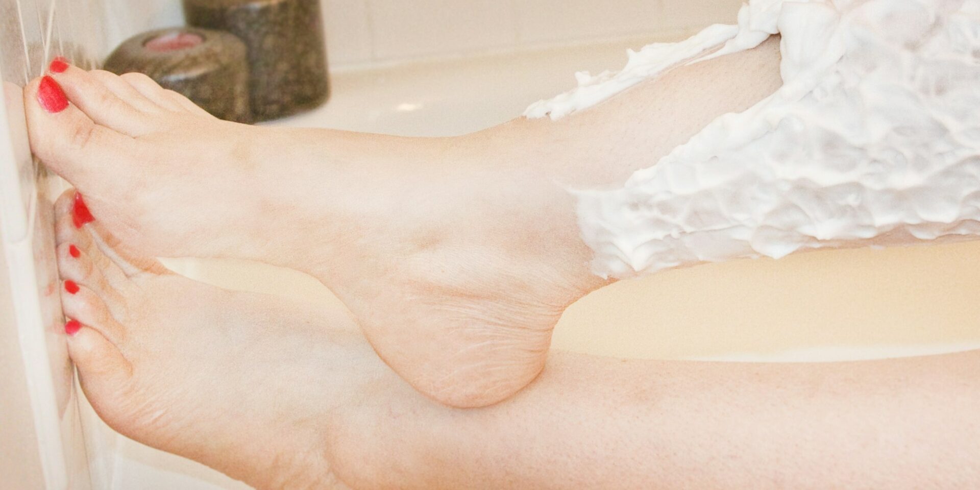 A woman shaves her legs after laser hair removal to reduce Folliculitis in Meridian Idaho