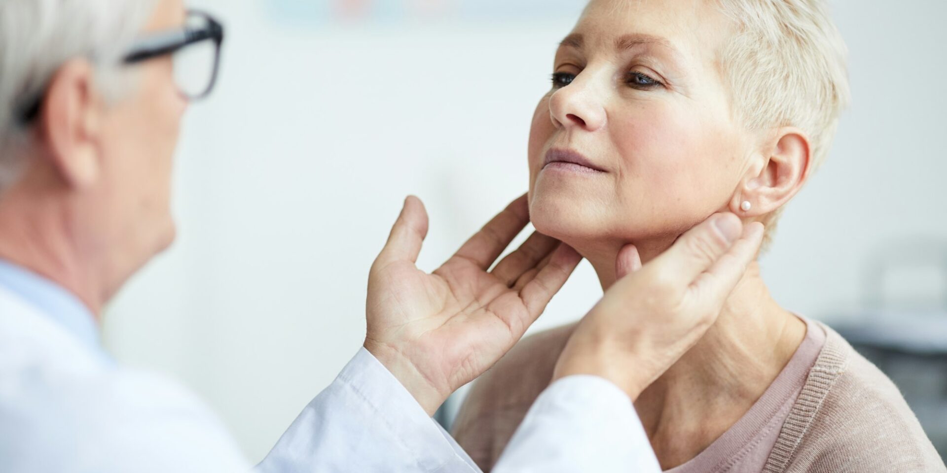 Examining patients thyroid