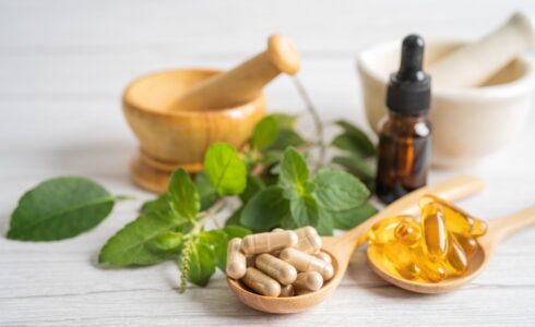 Alternative medicine herbal organic capsule drug with herbs leaf natural