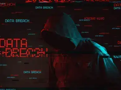 blog1-new - ATECHSO - Managed IT Company Hooded figure in red digital noise with the words 'Data Breach' repeating across the image, symbolizing a hacker attack and the threat of compromised data security.