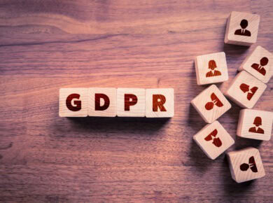 blog2-1 - ATECHSO - Managed IT Company The image shows wooden blocks with the letters "GDPR," which stands for General Data Protection Regulation, a significant piece of European Union legislation aimed at protecting personal data and privacy.