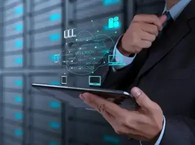 shutterstock_163229387 - ATECHSO - Managed IT Company Business professional using a tablet with futuristic holographic interface graphics, symbolizing advanced technology in data management, analytics, or cloud computing.