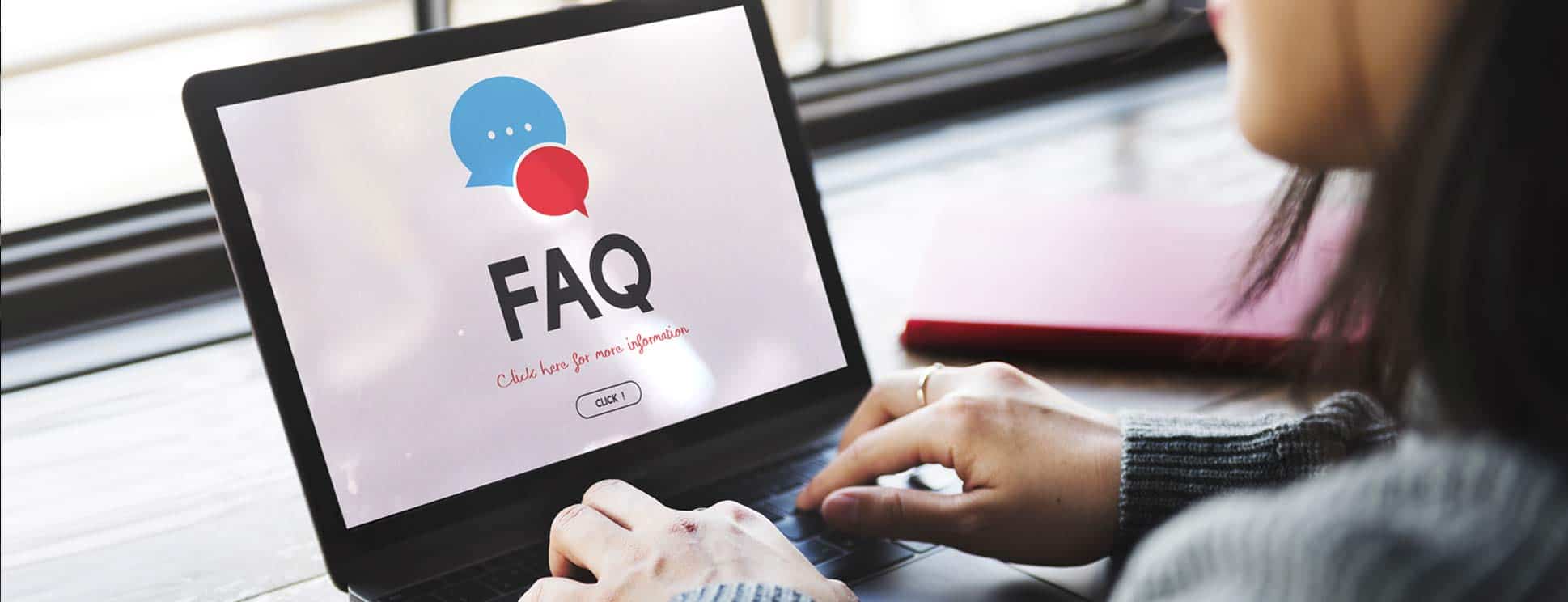 Woman-Typing-FAQs on-Laptop