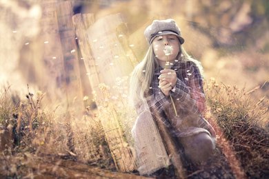 petite fille qui fait un voeu