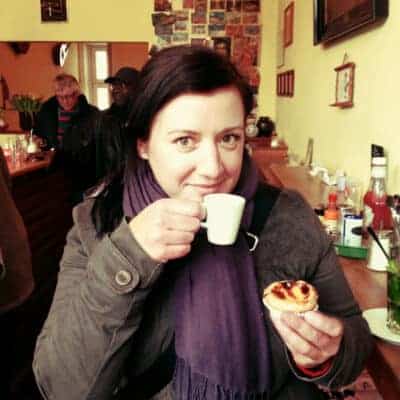 Andrea eating a Portuguese tart in Hamburg.