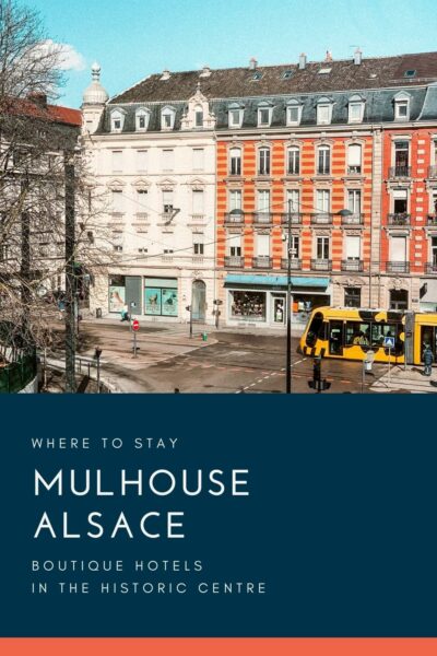 Historic buildings in Mulhouse and tram in front.