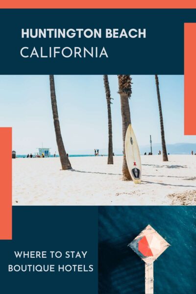 White sand with surfboard propped against palm tree.