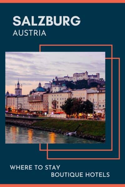 The Danube riverfront in Salzburg with the castle in the background, at sunrise.