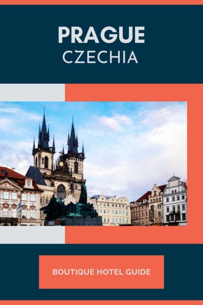 Historic main square in Prague with statue and church.