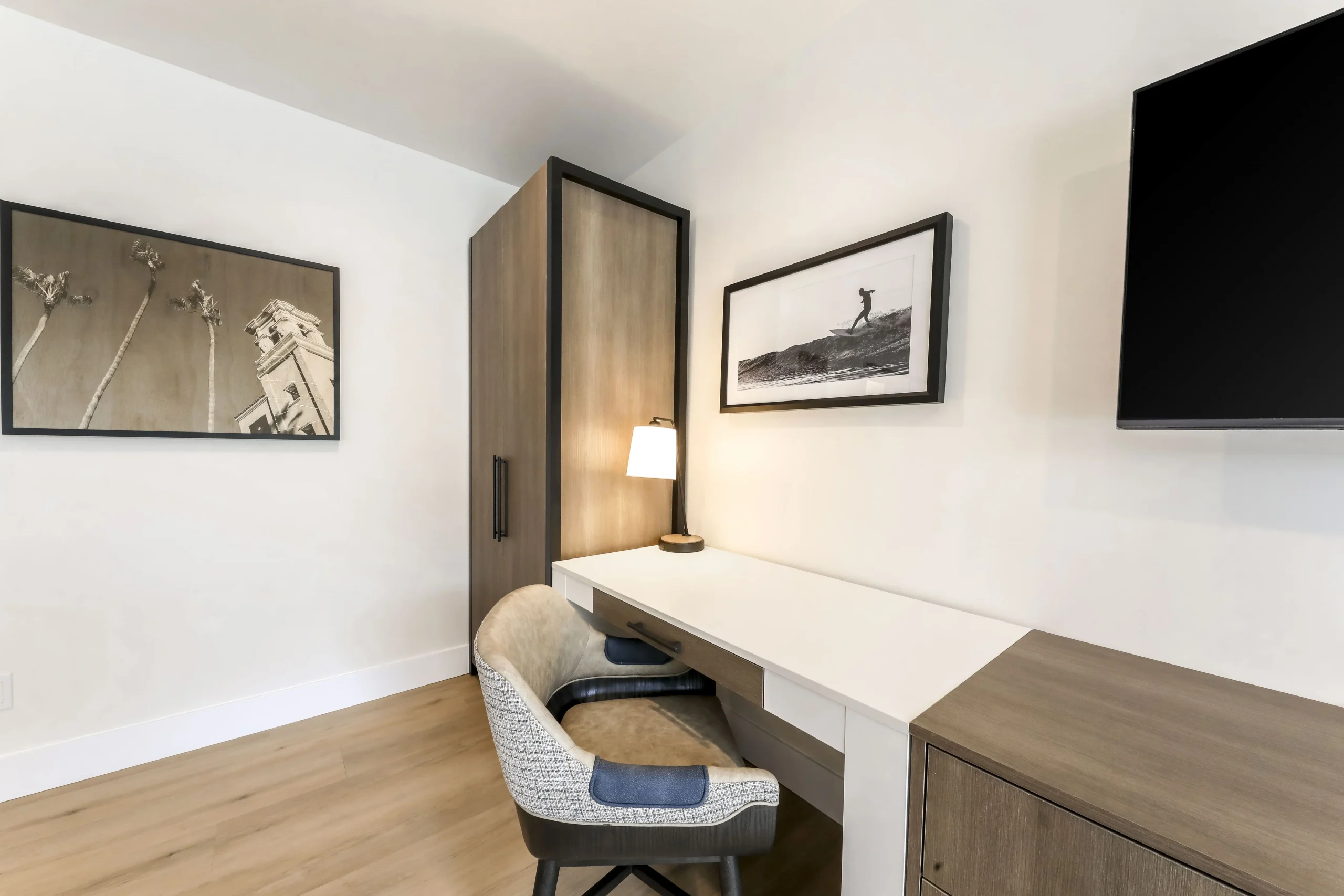 Two queen guest room amenities including closet and desk.