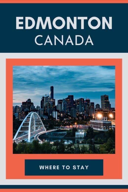 Aerial view of Edmonton city skyline and bridge at dusk.