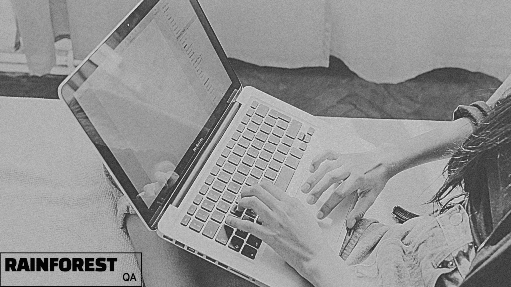 qa test coverage planning Image shows a woman typing at her computer while sitting on a bed or couch, her face out of the frame; you can see a mostly blank laptop screen and her fingers typing
