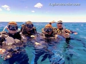 Bakasyon at Scuba Diving sa Coral Reefs ng Pilipinas - A group of people swimming in a body of water - Sea