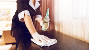 housekeeper-cleaning-room