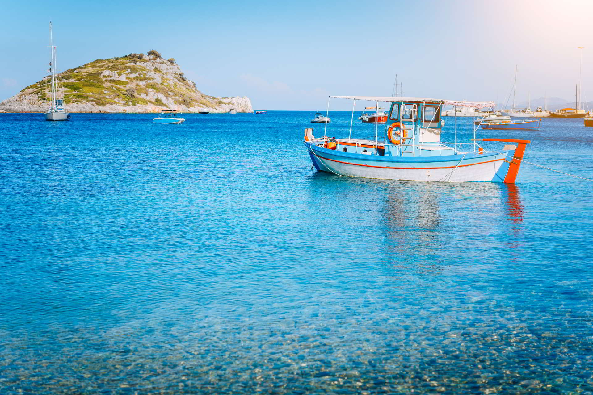 colorful greek fishing boat calm clear water early summer morning white rock