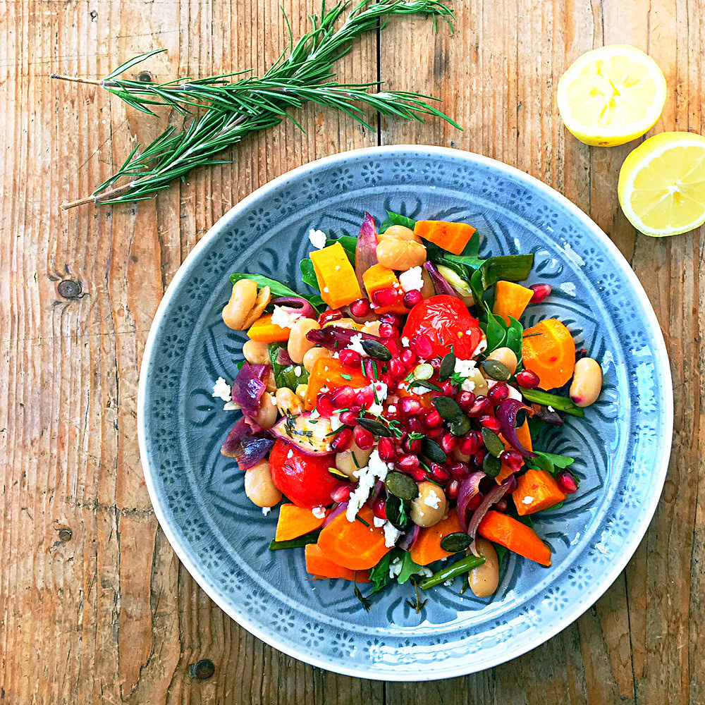 Sweet potato summer bake with feta, pomegranate and fresh herbs