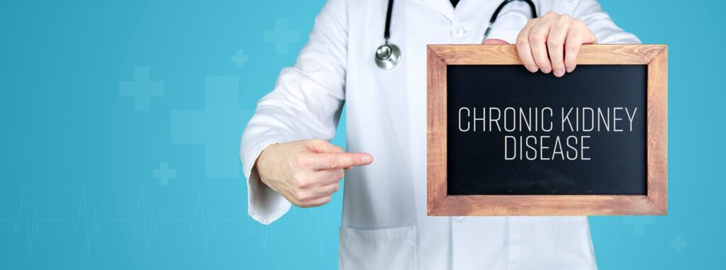 Chronic kidney disease. Doctor shows medical term on a sign/board