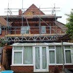 Scaffolding on house for wall tie replacement