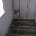 lateral restraint ties installed in floor joists and timber frame