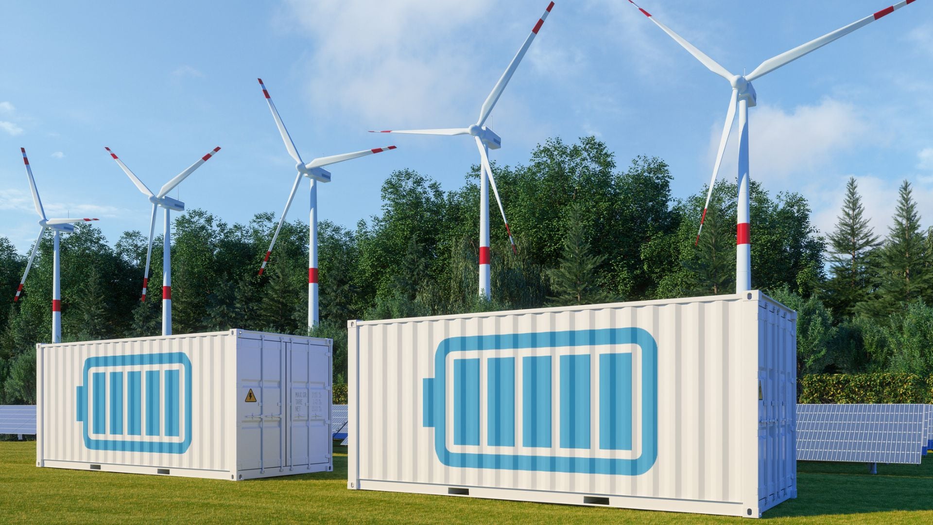 Sistema de almacenamiento de energía con panel solar, turbinas eólicas y contenedor de baterías de iones de litio (Getty)