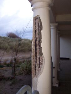 Damaged concrete column caused by rusted rebar