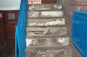 concrete steps damaged by rusting rebar