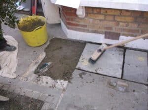 Relaying flagstones following underpinning