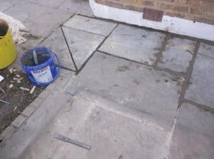 Flagstones relayed following foundation repairs