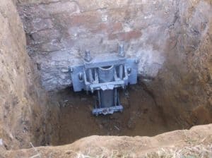 Underpinning of foundations using screw piles and brackets