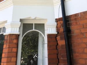 Vertical crack between bay window and front elevation of house