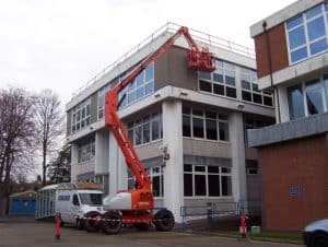 Using cherry picker to carry out concrete repair work