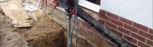installing micro piles for foundation repair following subsidence
